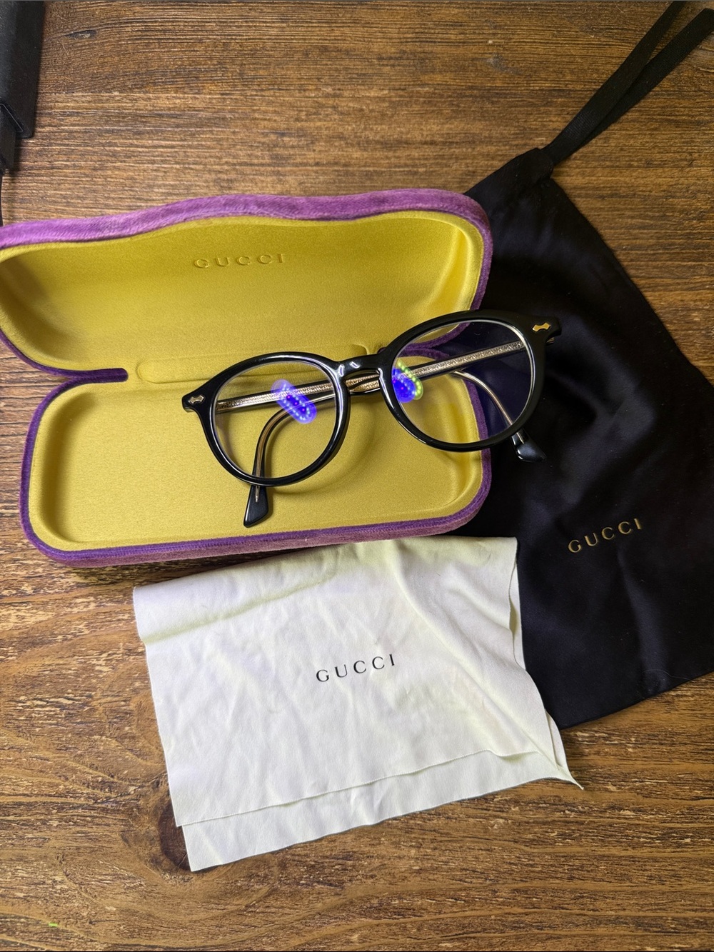Gucci Black Round Optical Glasses with purple case, dust bag, and cleaning cloth